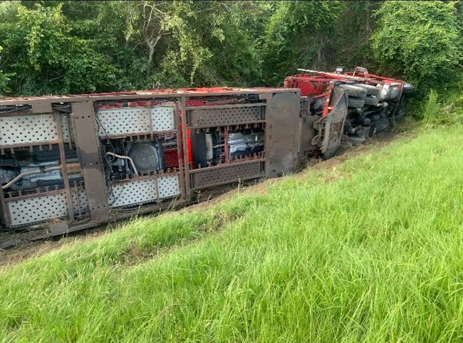 An overturned loaded car hauler that we recovered out of the ditch.